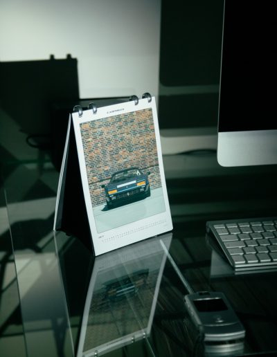 Carphiles 2025 Classic Car Calendar highlighting a Ferrari 512 BBI, showcasing bold Italian engineering"