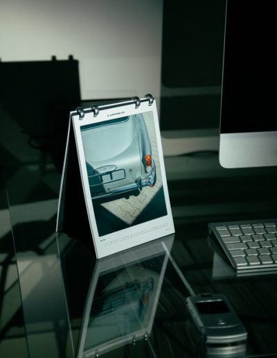 Carphiles 2025 Classic Car Calendar featuring a vintage Aston Martin DB5